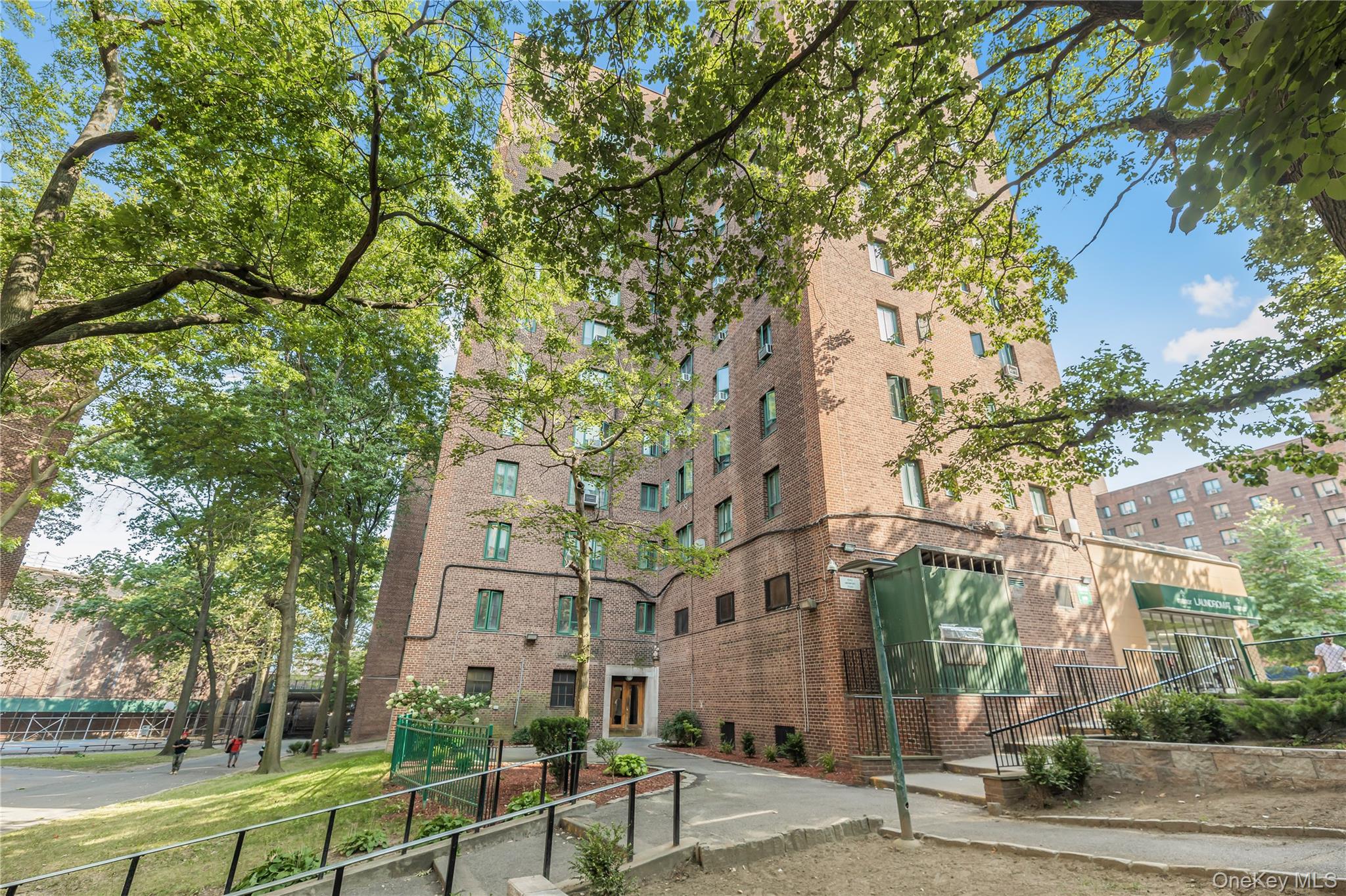 1540 Unionport Road, Unit 7F Bronx, NY 10462 - Photo 13 of 16 a view of a building with a yard