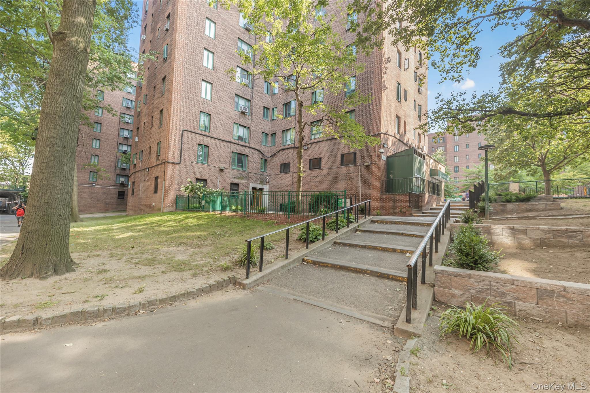 1540 Unionport Road, Unit 7F Bronx, NY 10462 - Photo 14 of 16 a view of a park with large trees