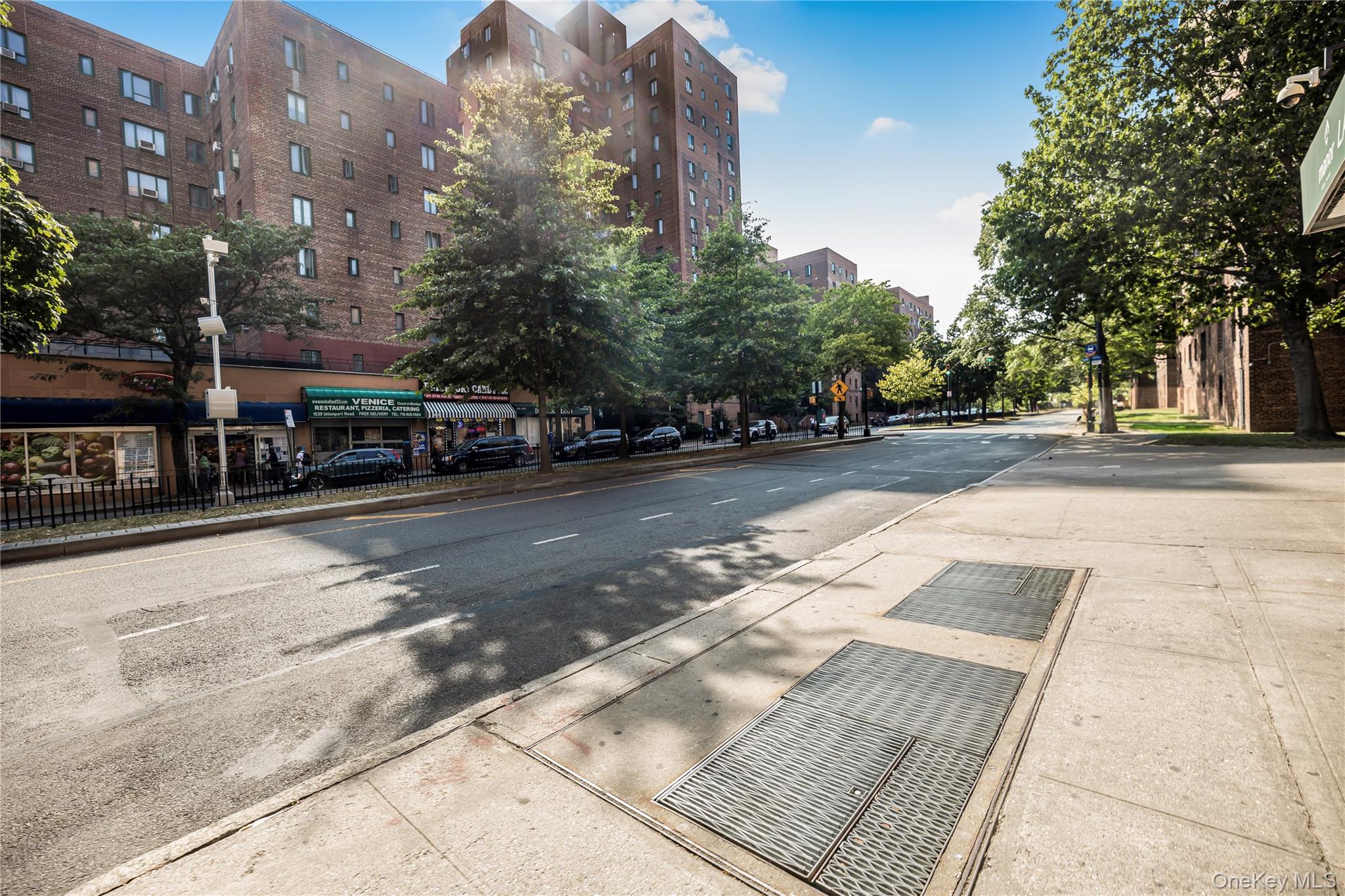 1540 Unionport Road, Unit 7F Bronx, NY 10462 - Photo 6 of 16 a view of a street with a building in the background
