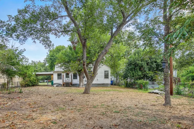 a house with trees in front of it
