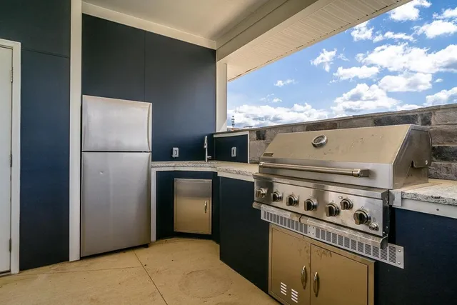 a kitchen with a stove and a refrigerator