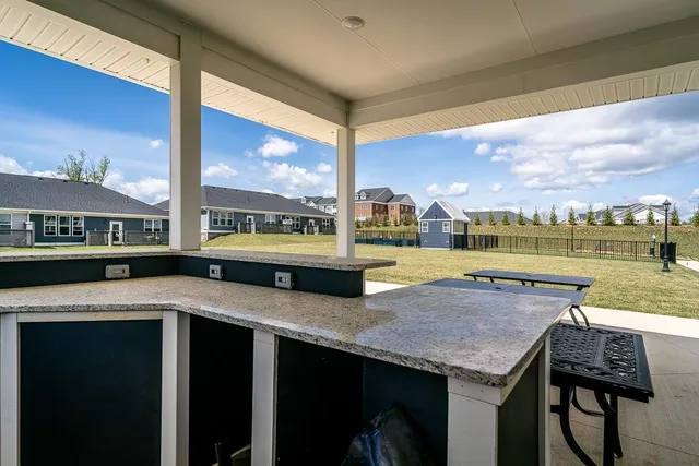 a view of swimming pool with a patio