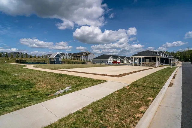 a view of swimming pool with outdoor seating and garden