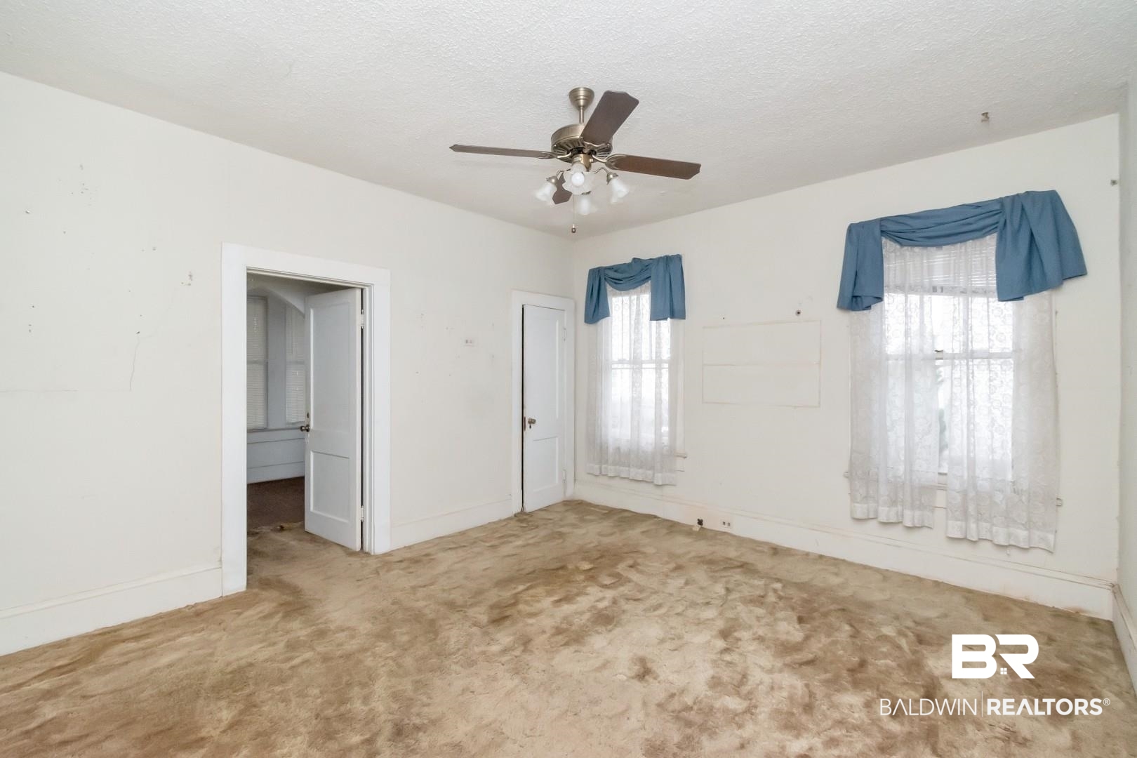 4305 Stein Street Mobile, AL 36608 - Photo 16 of 22 Carpeted empty room with ceiling fan and a textured ceiling