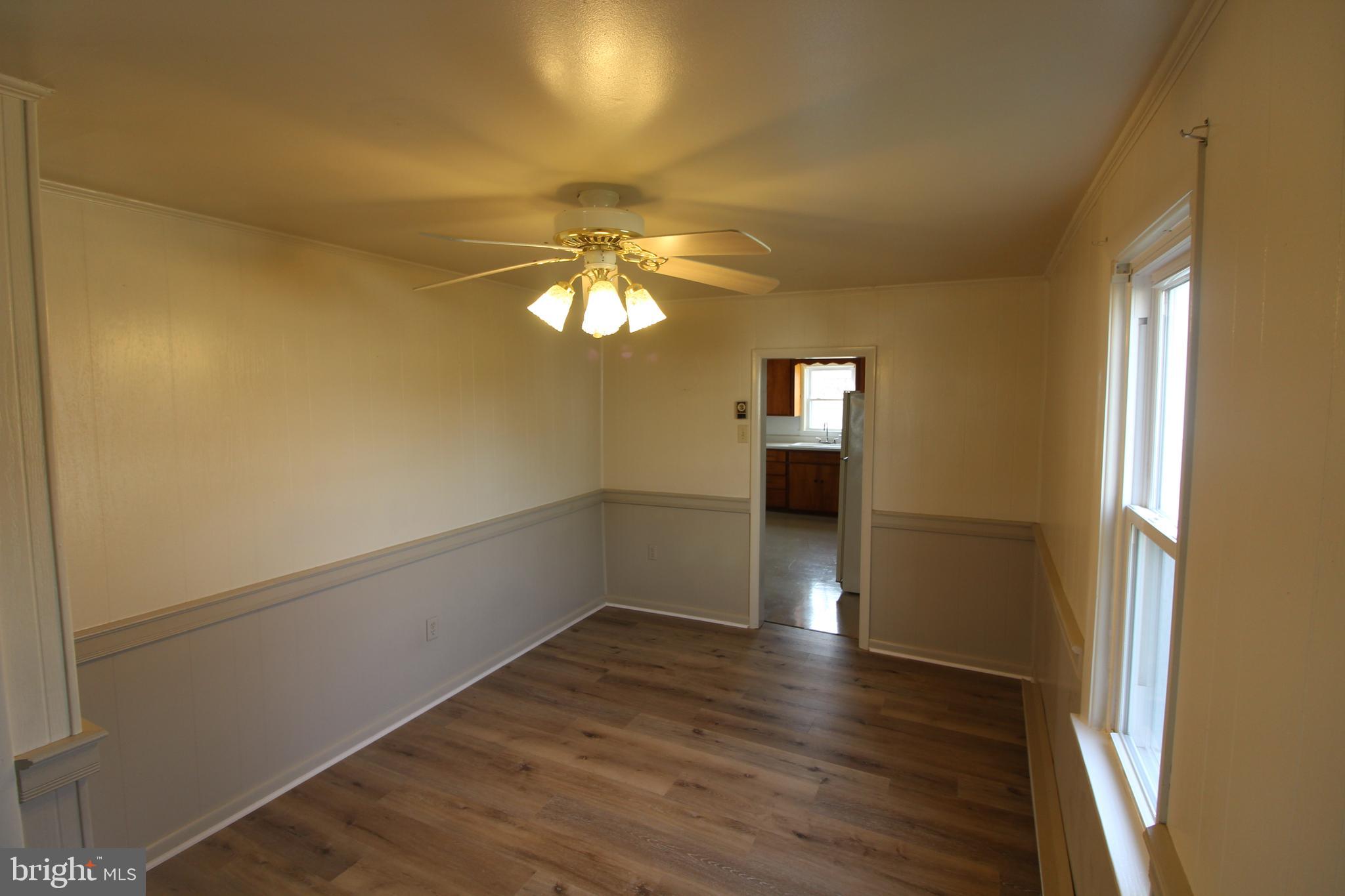 19801 Senedo Road Edinburg, VA 22824 - Photo 4 of 16 a view of empty room with wooden floor