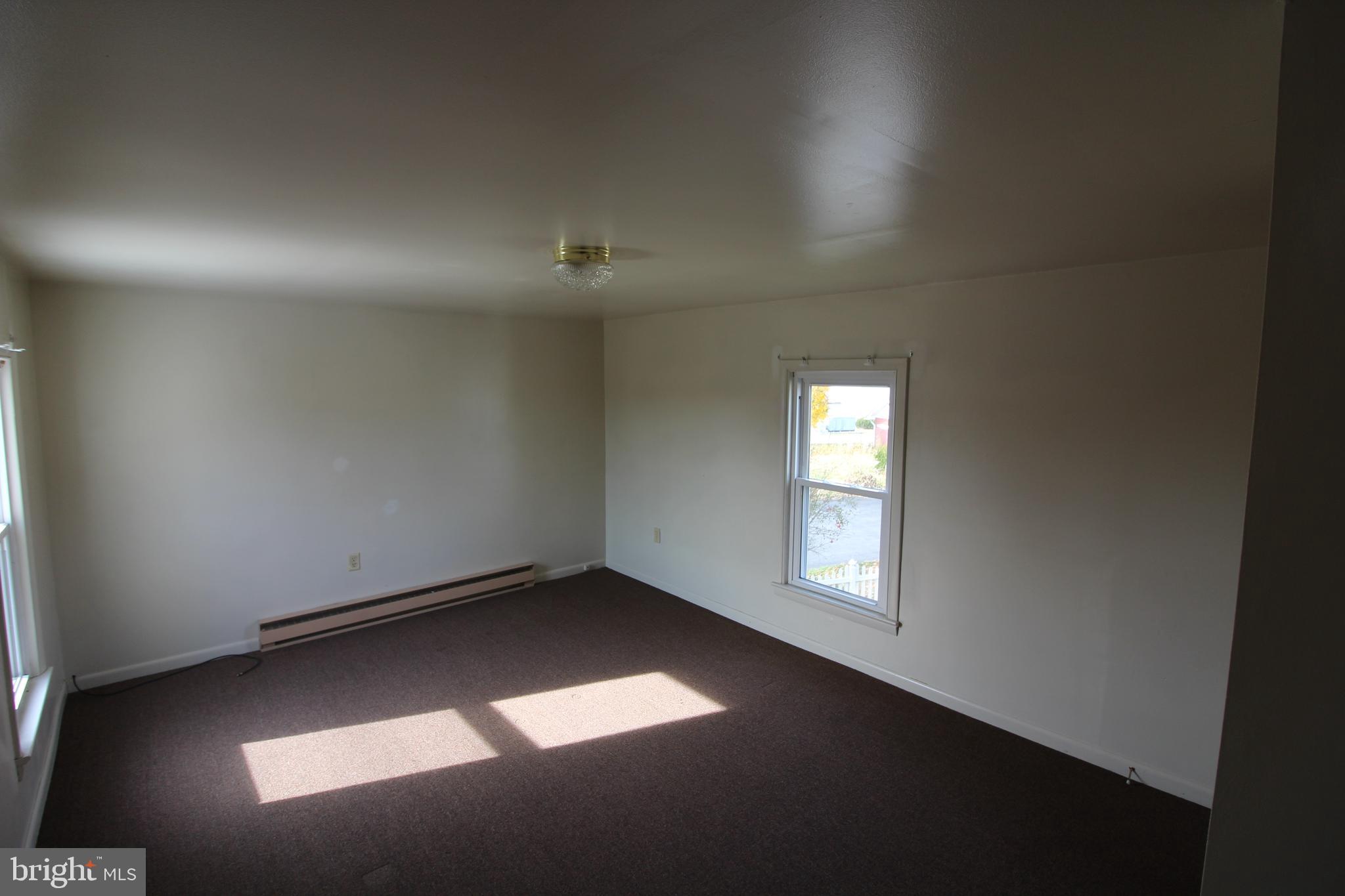 19801 Senedo Road Edinburg, VA 22824 - Photo 8 of 16 an empty room with a window
