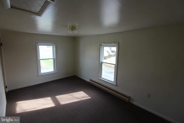 an empty room with windows
