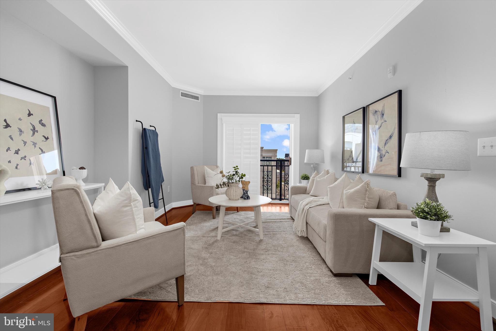 5 Park Place, Unit 702 Annapolis, MD 21401 - Photo 13 of 55 a living room with furniture and a flat screen tv