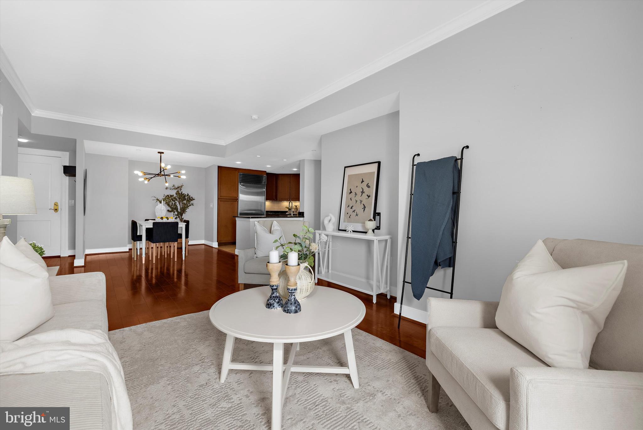 5 Park Place, Unit 702 Annapolis, MD 21401 - Photo 14 of 55 a living room with furniture and a dining room
