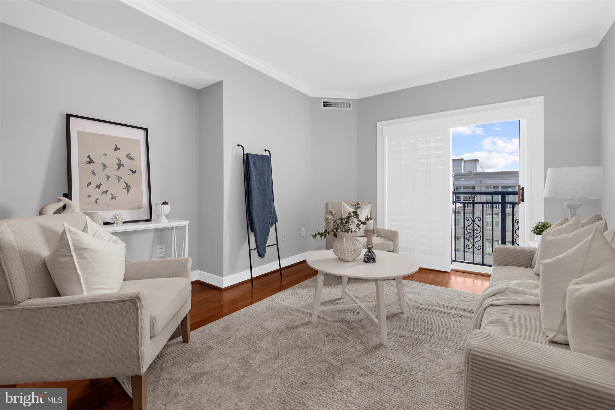 5 Park Place, Unit 702 Annapolis, MD 21401 - Photo 15 of 55 a living room with furniture and a flat screen tv