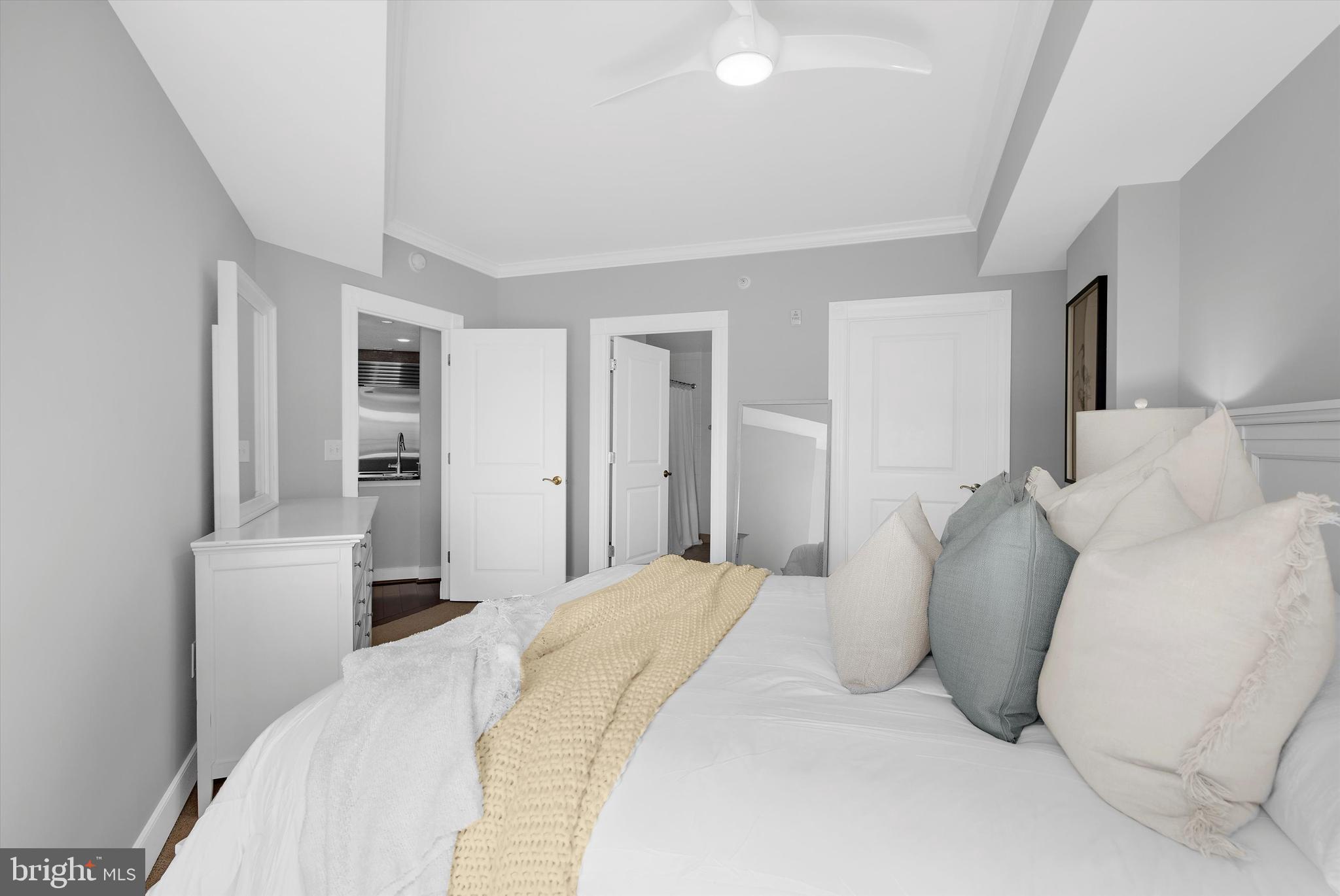 5 Park Place, Unit 702 Annapolis, MD 21401 - Photo 16 of 55 a bedroom with a bed and a couch