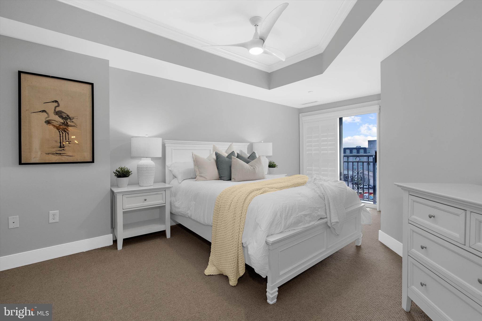 5 Park Place, Unit 702 Annapolis, MD 21401 - Photo 19 of 55 a bed room with a bed and a window