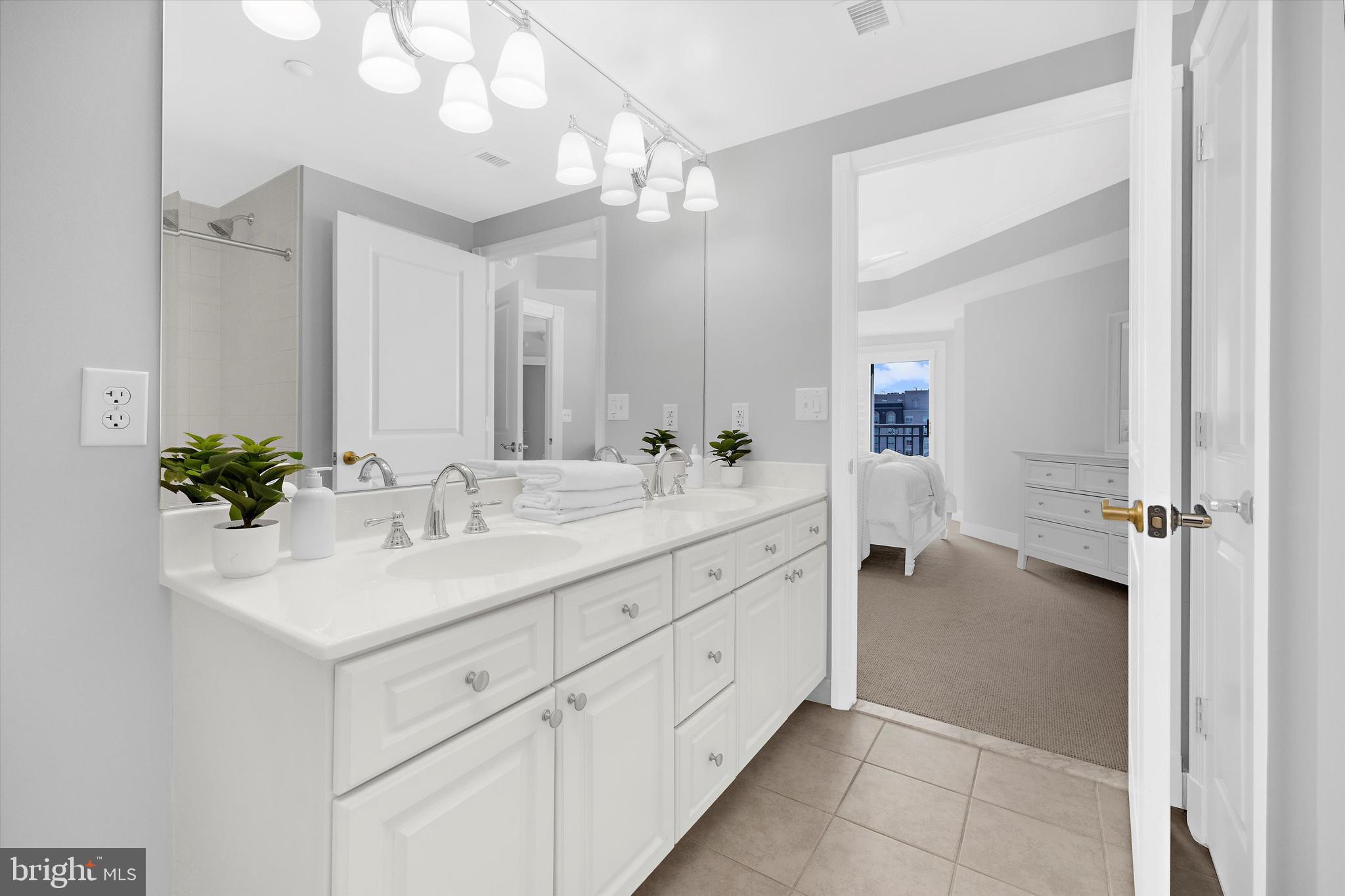 5 Park Place, Unit 702 Annapolis, MD 21401 - Photo 22 of 55 a bathroom with a sink vanity and a mirror
