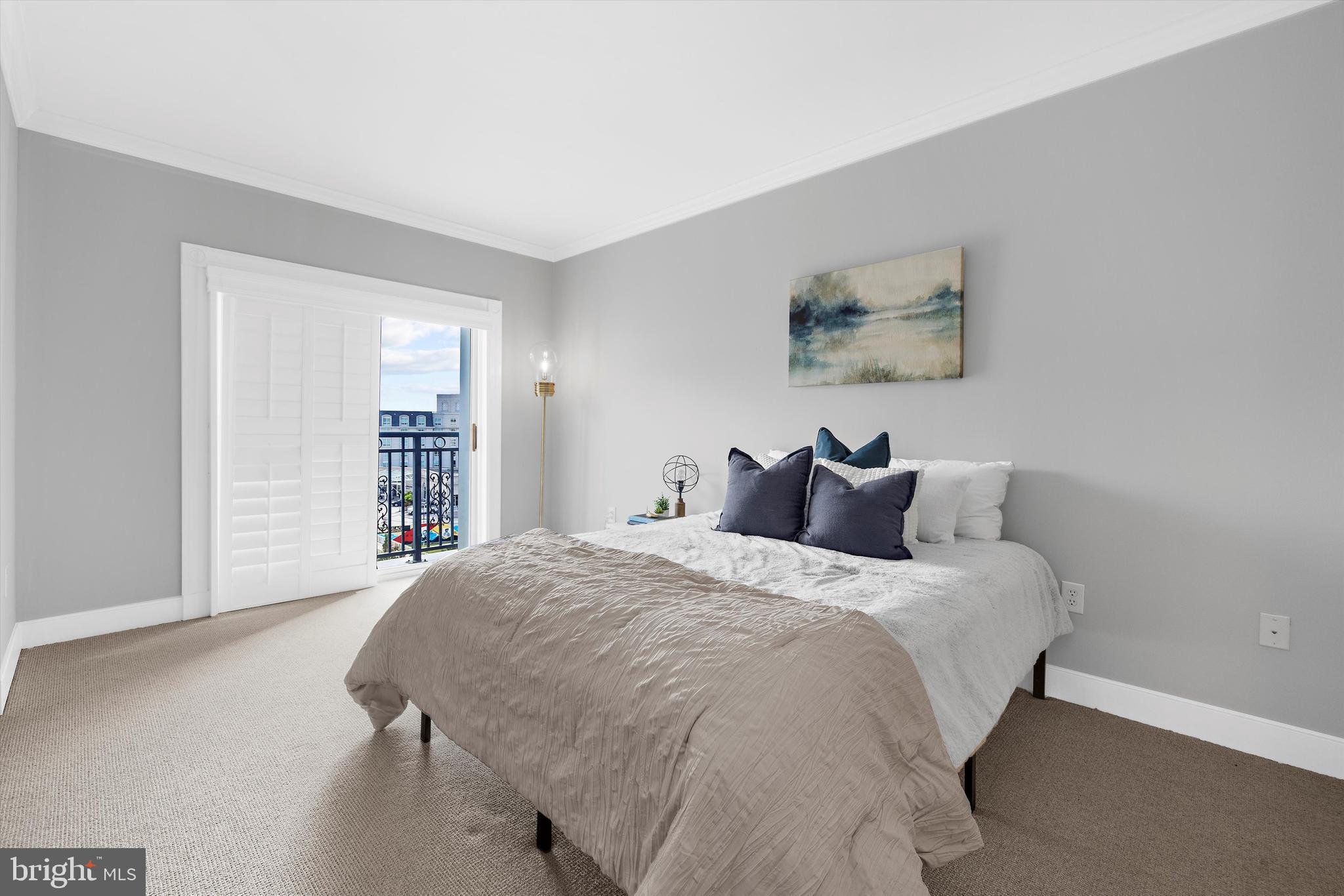 5 Park Place, Unit 702 Annapolis, MD 21401 - Photo 25 of 55 a bedroom with a bed and a window