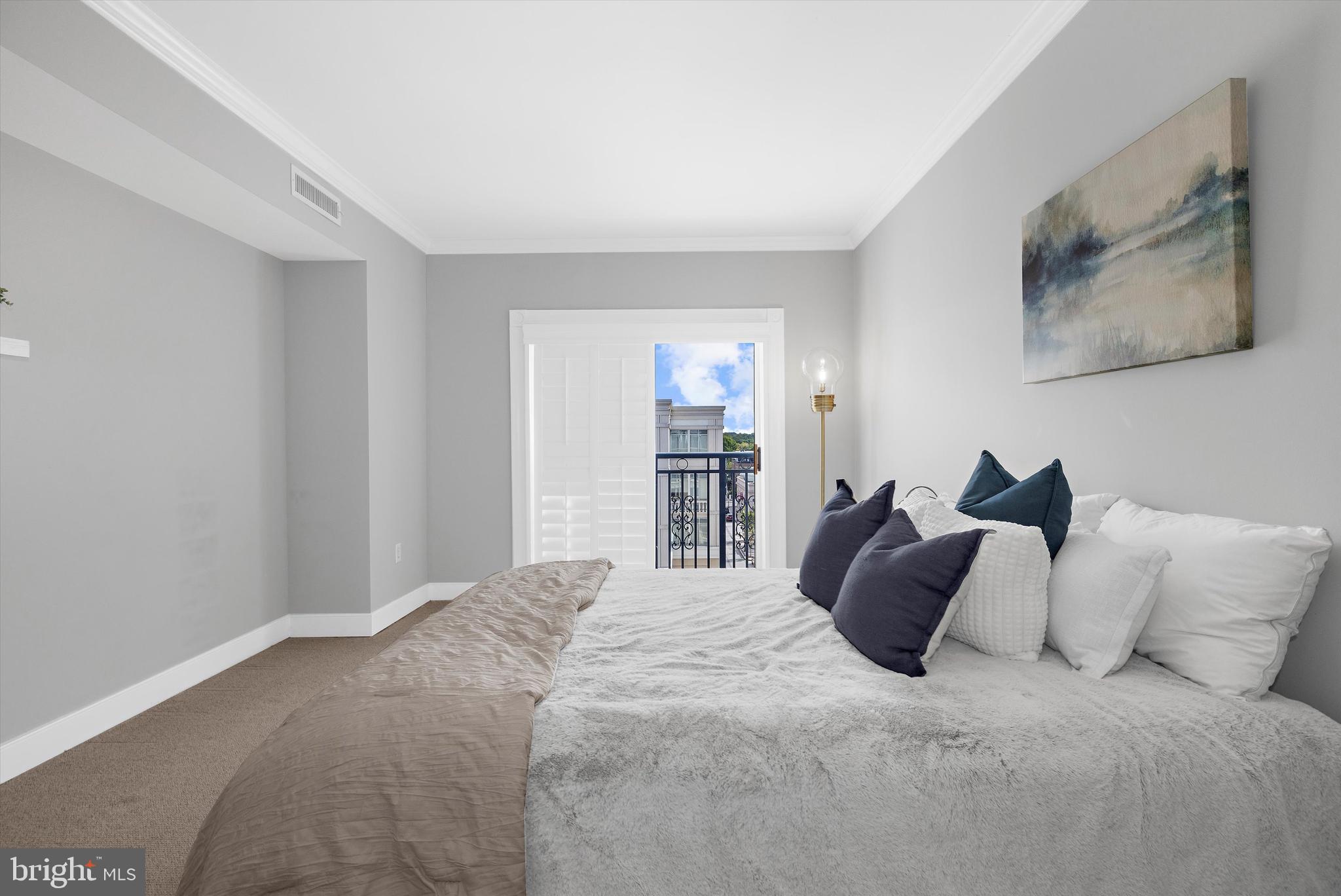 5 Park Place, Unit 702 Annapolis, MD 21401 - Photo 27 of 55 a large bed in a white room