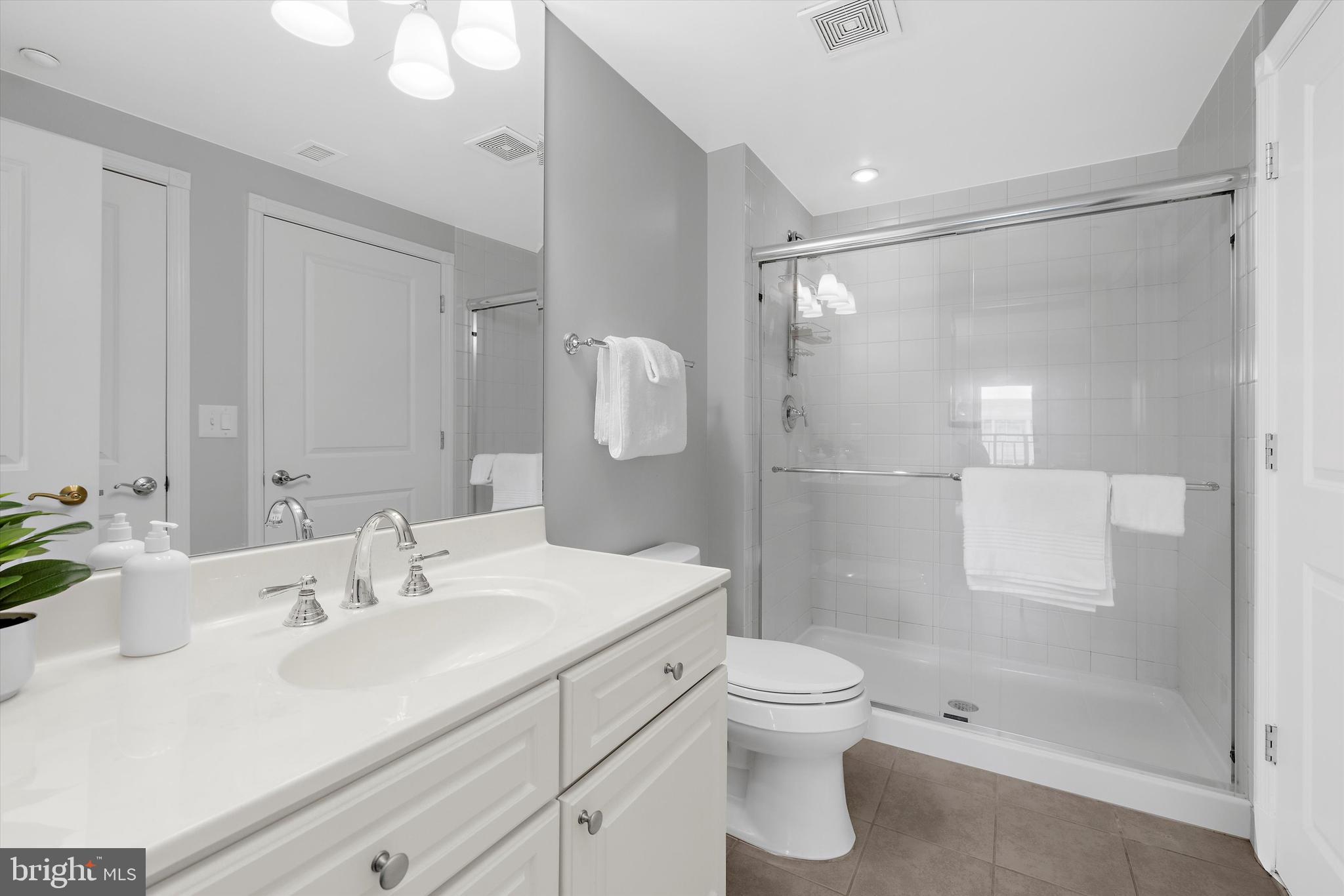 5 Park Place, Unit 702 Annapolis, MD 21401 - Photo 28 of 55 a bathroom with a sink a toilet and shower