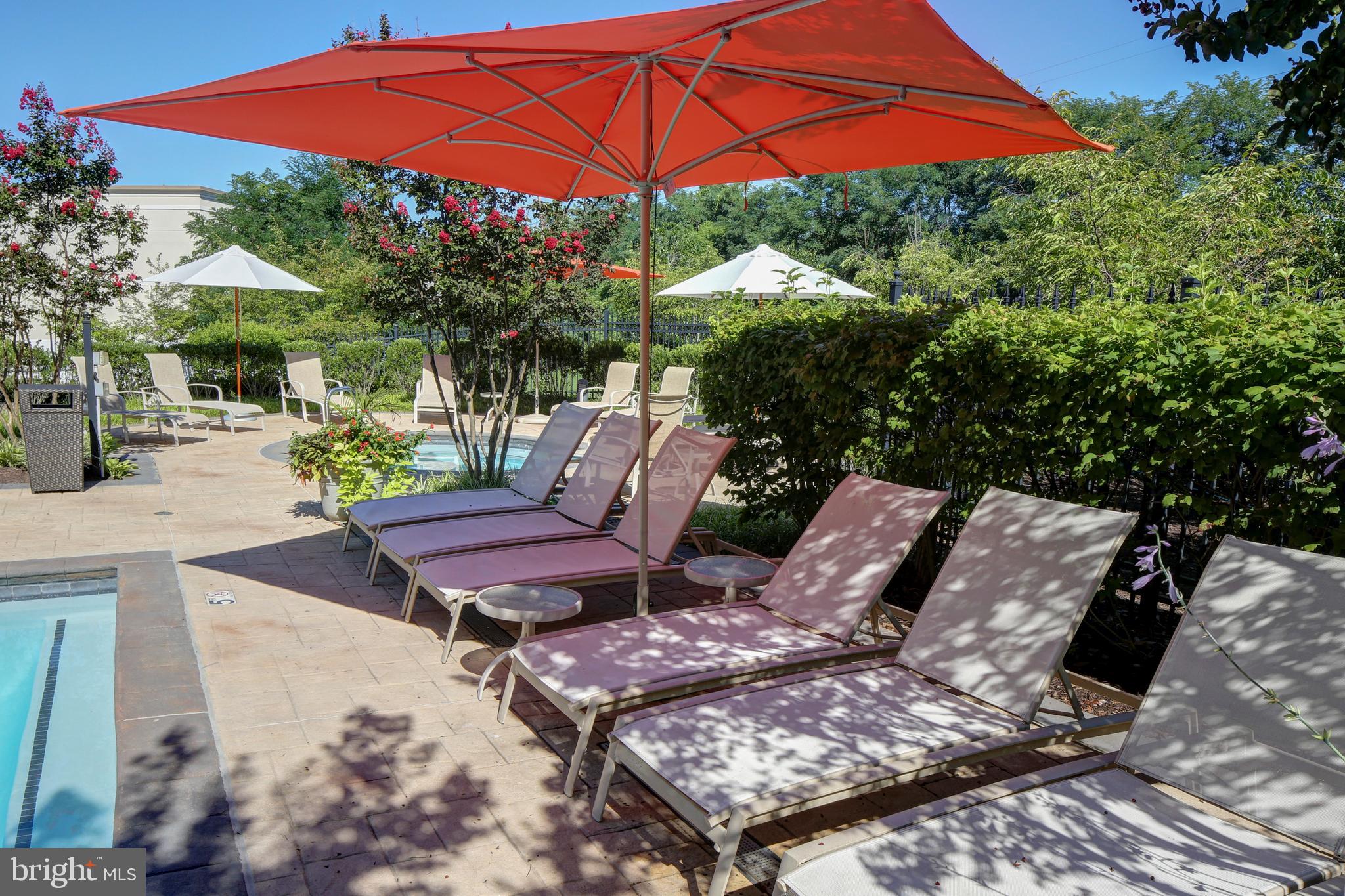 5 Park Place, Unit 702 Annapolis, MD 21401 - Photo 42 of 55 an outdoor sitting area with furniture and umbrella