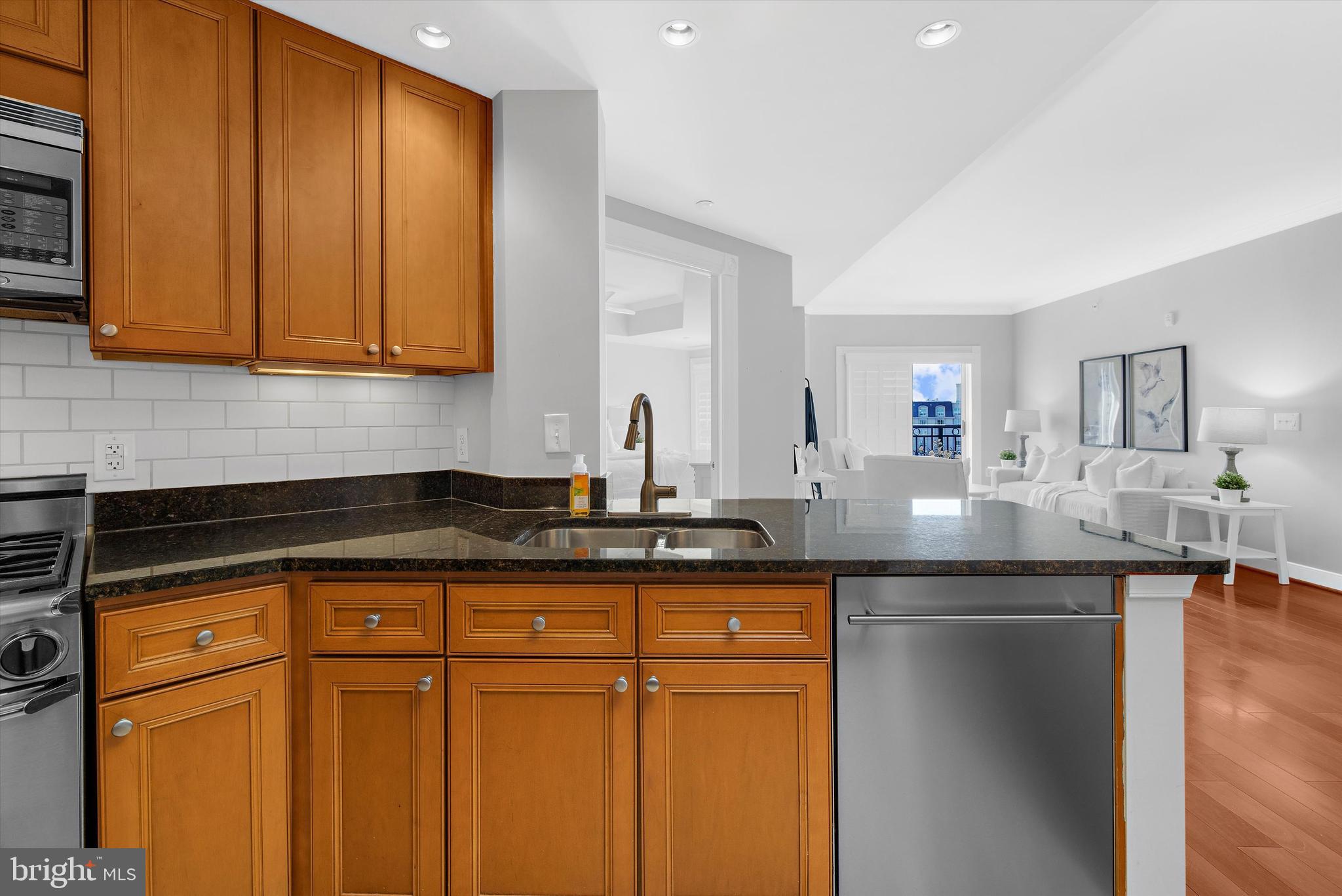 5 Park Place, Unit 702 Annapolis, MD 21401 - Photo 7 of 55 a kitchen with stainless steel appliances granite countertop a sink and cabinets