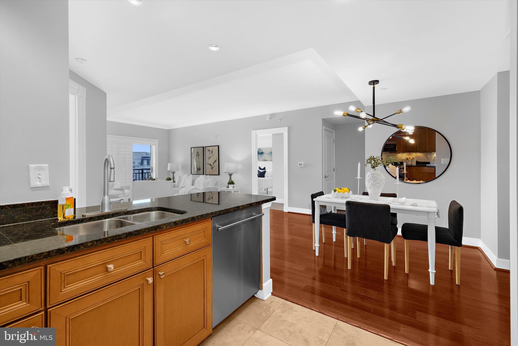 5 Park Place, Unit 702 Annapolis, MD 21401 - Photo 8 of 55 a dining hall with granite countertop a stove and a view of kitchen
