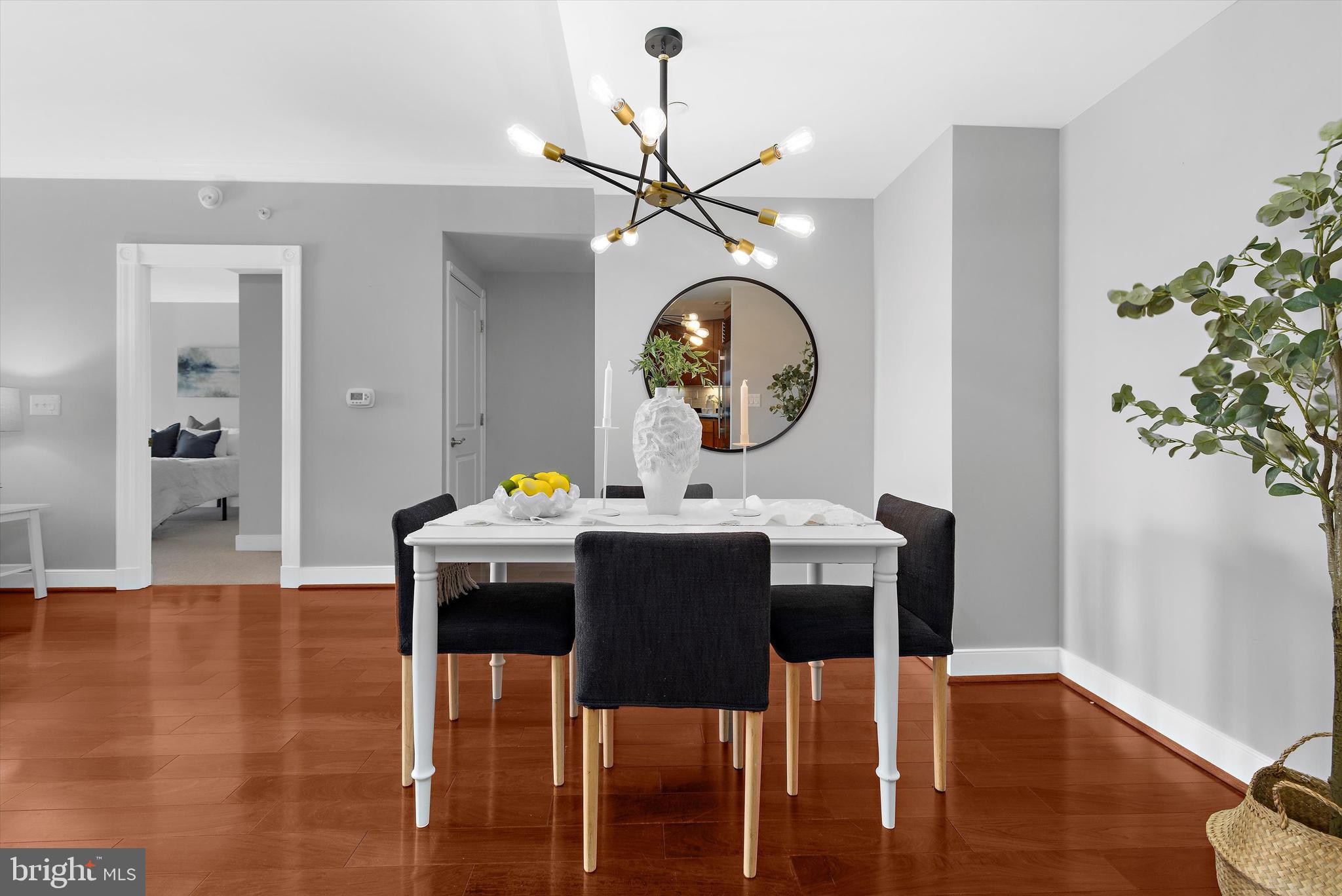 5 Park Place, Unit 702 Annapolis, MD 21401 - Photo 9 of 55 a view of a dining room with furniture and wooden floor