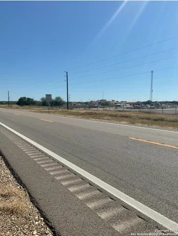 a view of an ocean and trees
