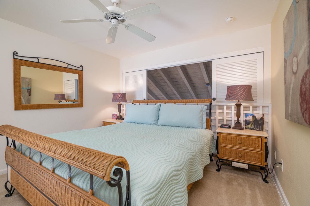 2777 South Kihei Road, Unit L204 Kihei, HI 96753 - Photo 14 of 30 a bedroom with a bed and a chandelier