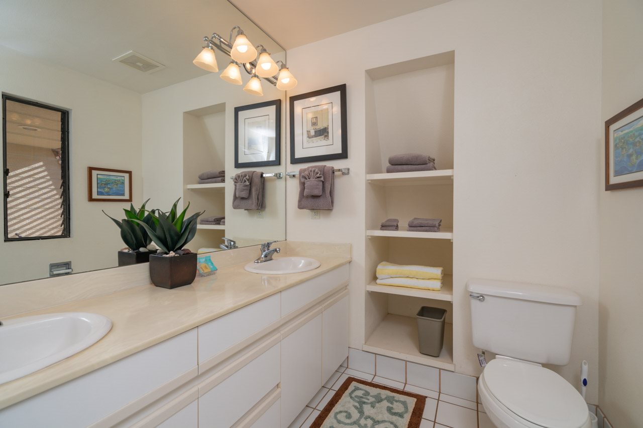 2777 South Kihei Road, Unit L204 Kihei, HI 96753 - Photo 16 of 30 a bathroom with a toilet a sink and mirror