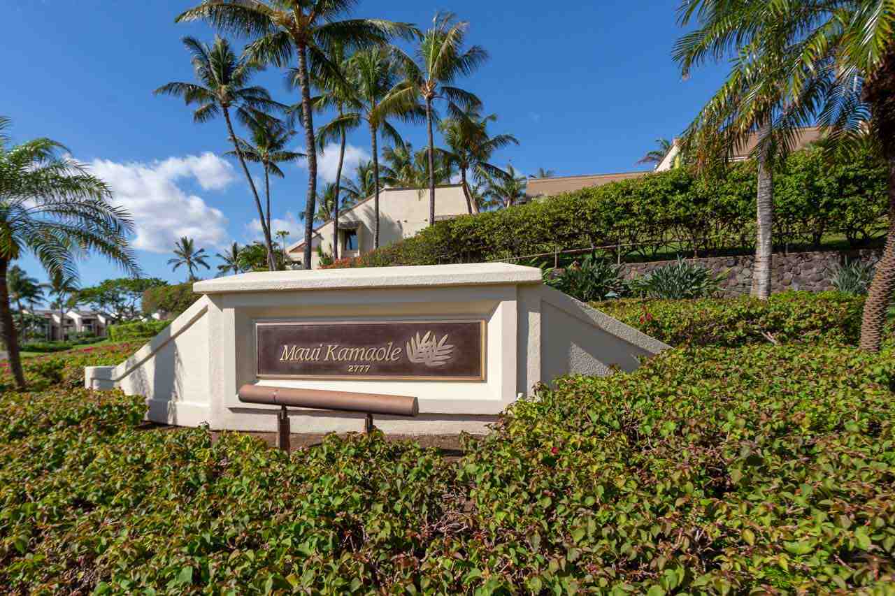 2777 South Kihei Road, Unit L204 Kihei, HI 96753 - Photo 30 of 30 a view of a house with a small yard plants and a large tree