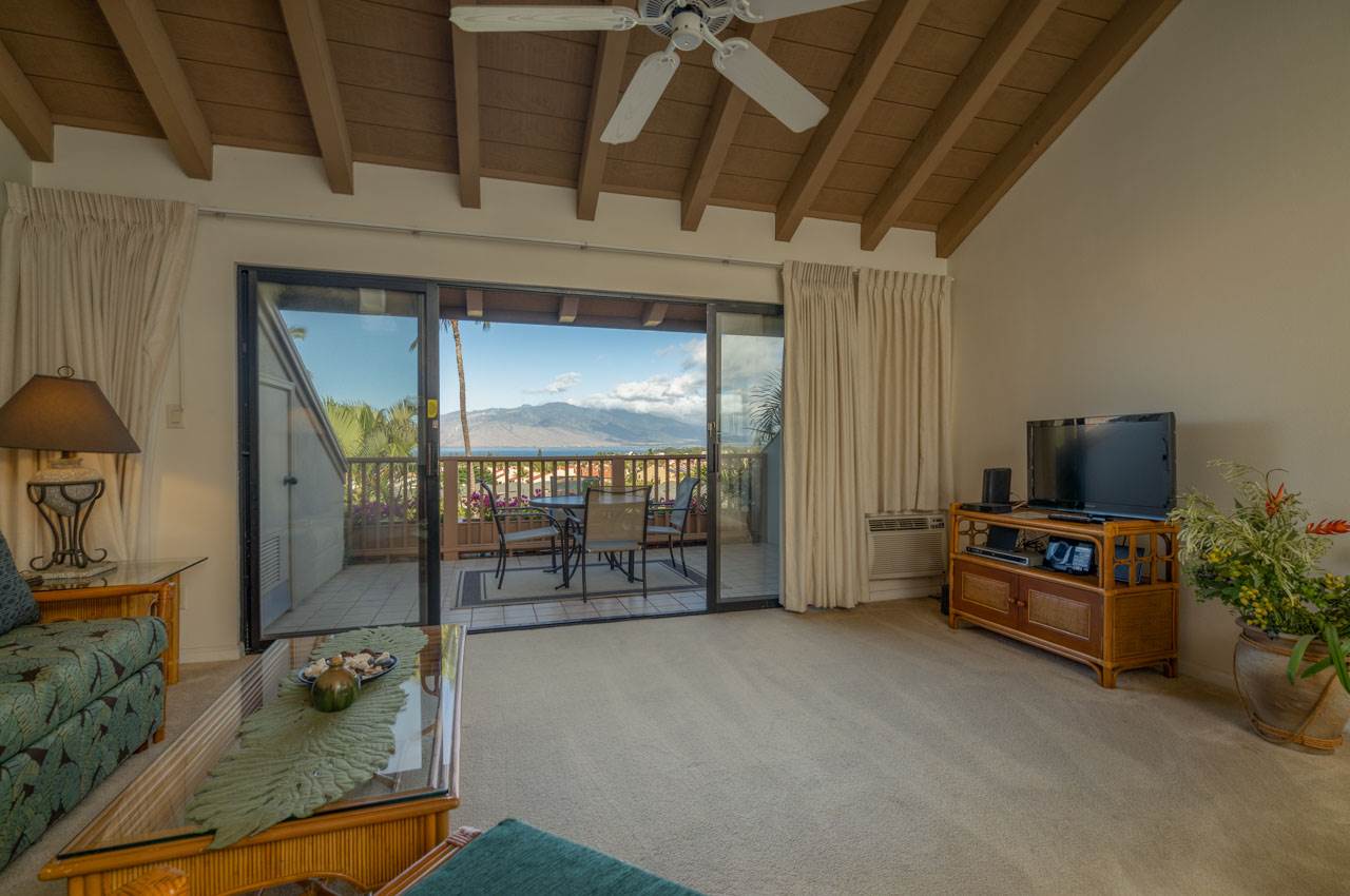 2777 South Kihei Road, Unit L204 Kihei, HI 96753 - Photo 3 of 30 a living room with furniture and a flat screen tv