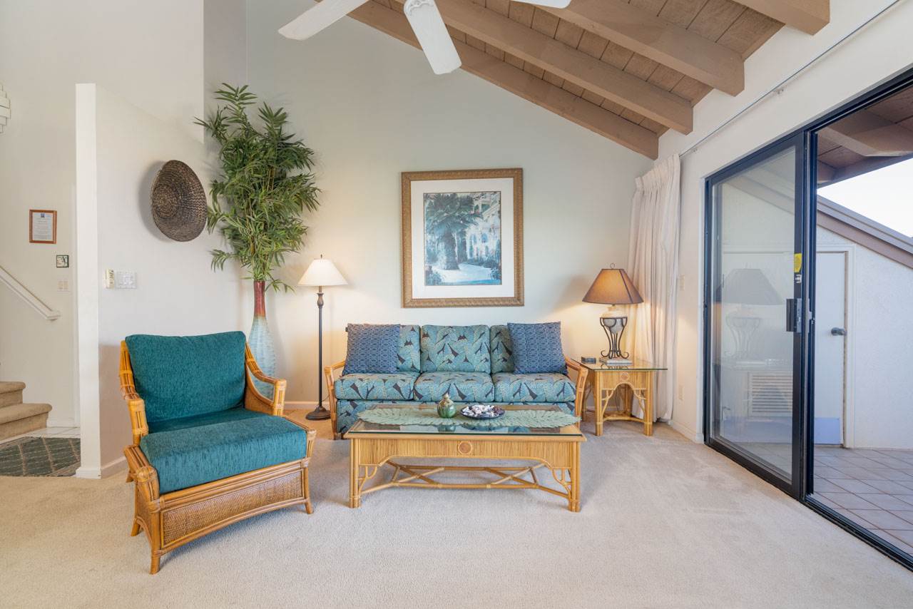 2777 South Kihei Road, Unit L204 Kihei, HI 96753 - Photo 5 of 30 a living room with furniture and a chandelier