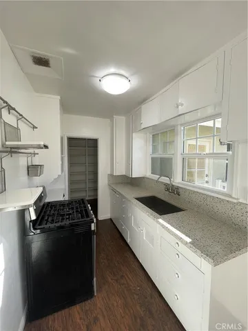 a kitchen with a stove and a sink