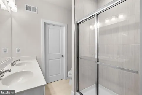 a bathroom with a sink and shower