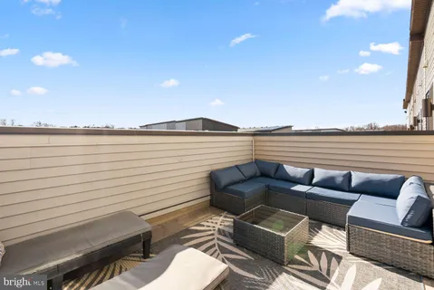 a view of a terrace with furniture