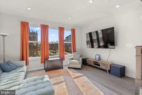 a bedroom with furniture and a flat screen tv