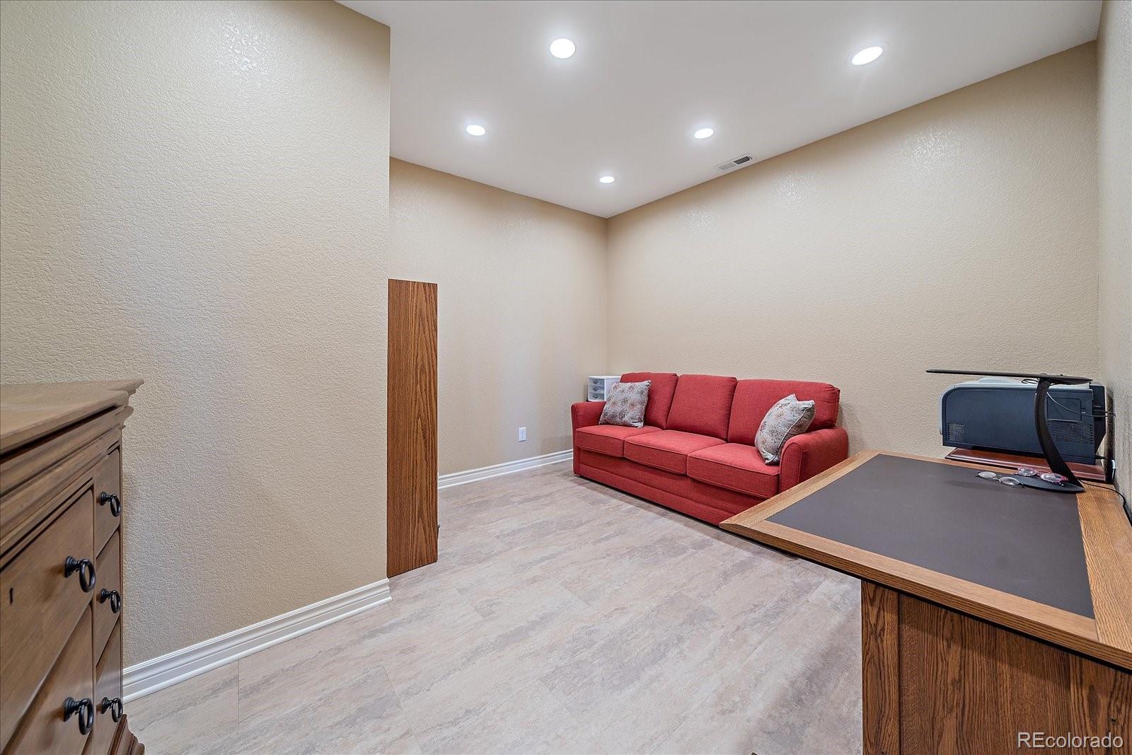 9317 Viaggio Way Highlands Ranch, CO 80126 - Photo 36 of 50 a living room with furniture