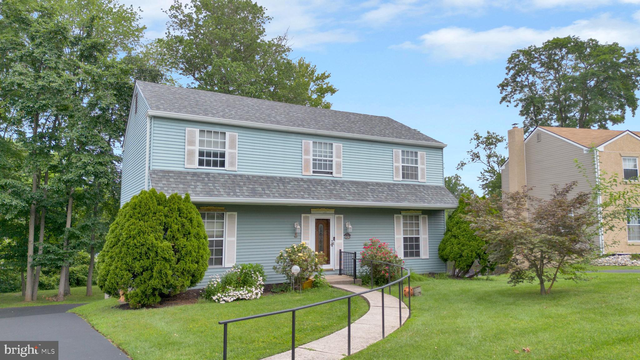 a front view of a house with a yard and porch