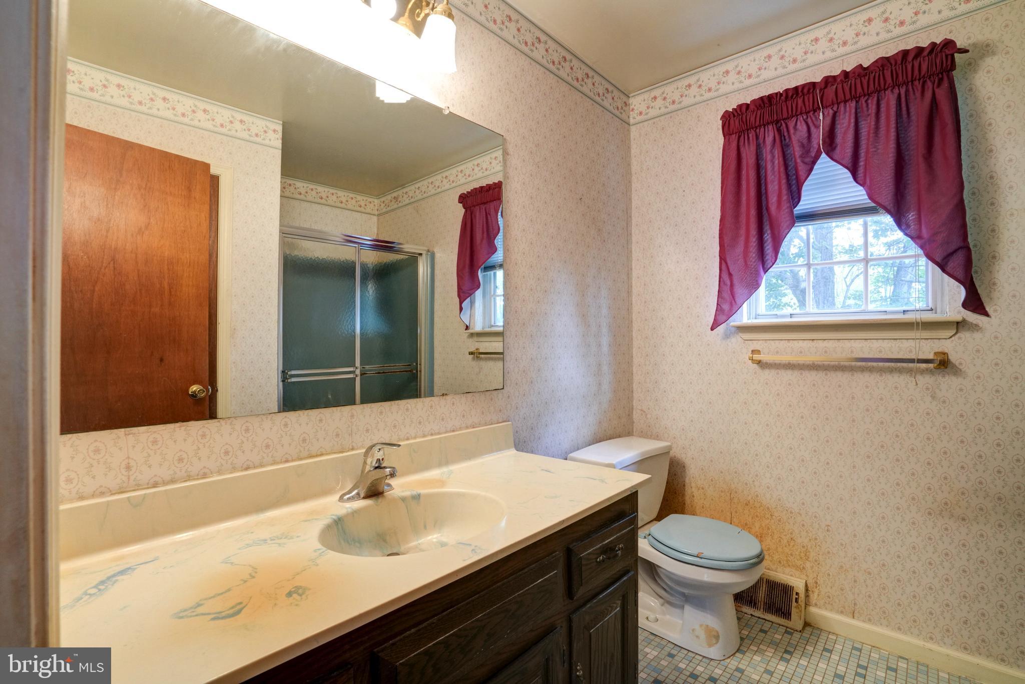 70 St Davids Road Springfield, PA 19064 - Photo 18 of 39 a bathroom with a sink vanity and a toilet