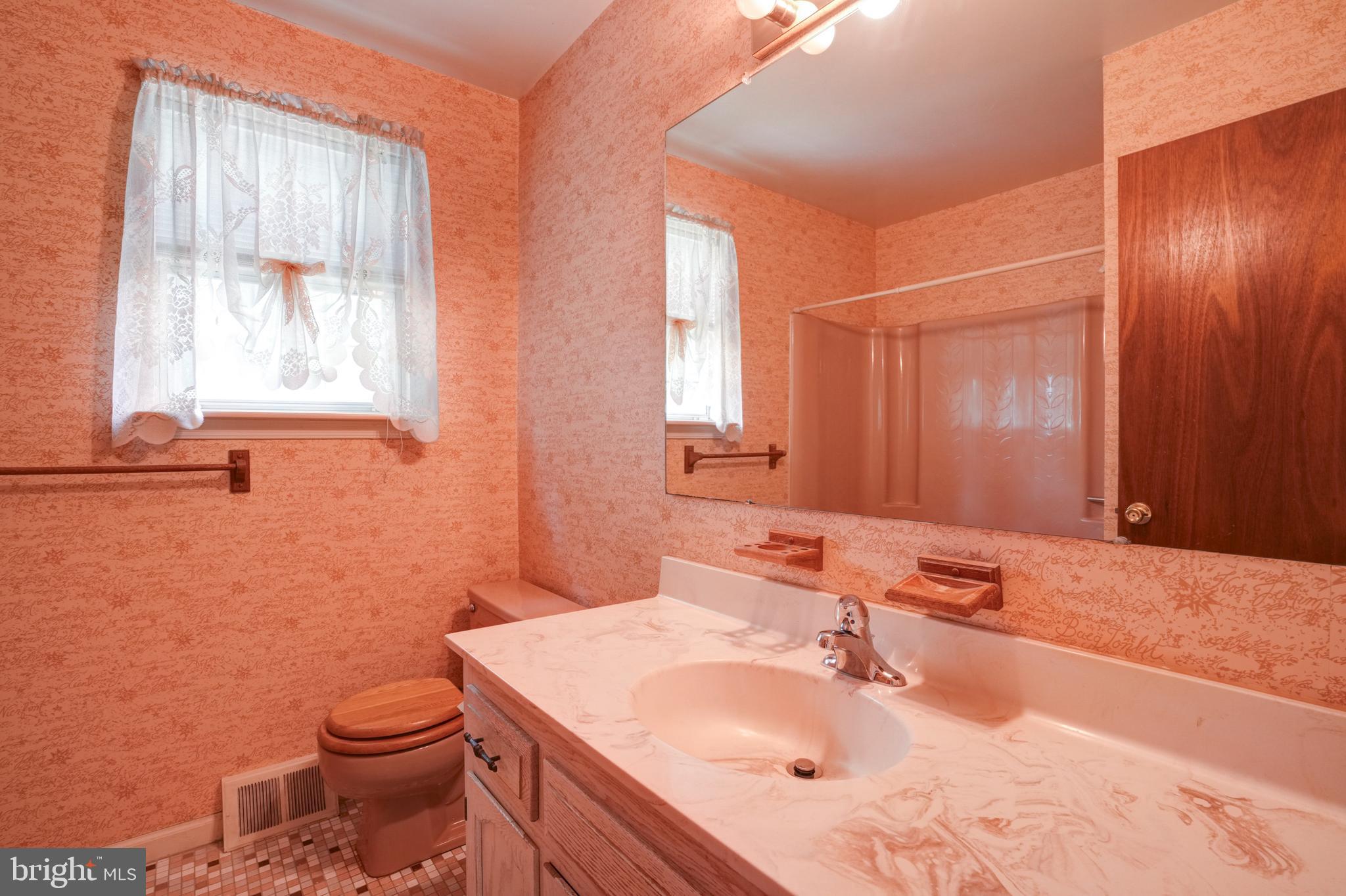 70 St Davids Road Springfield, PA 19064 - Photo 25 of 39 a bathroom with a sink toilet and mirror