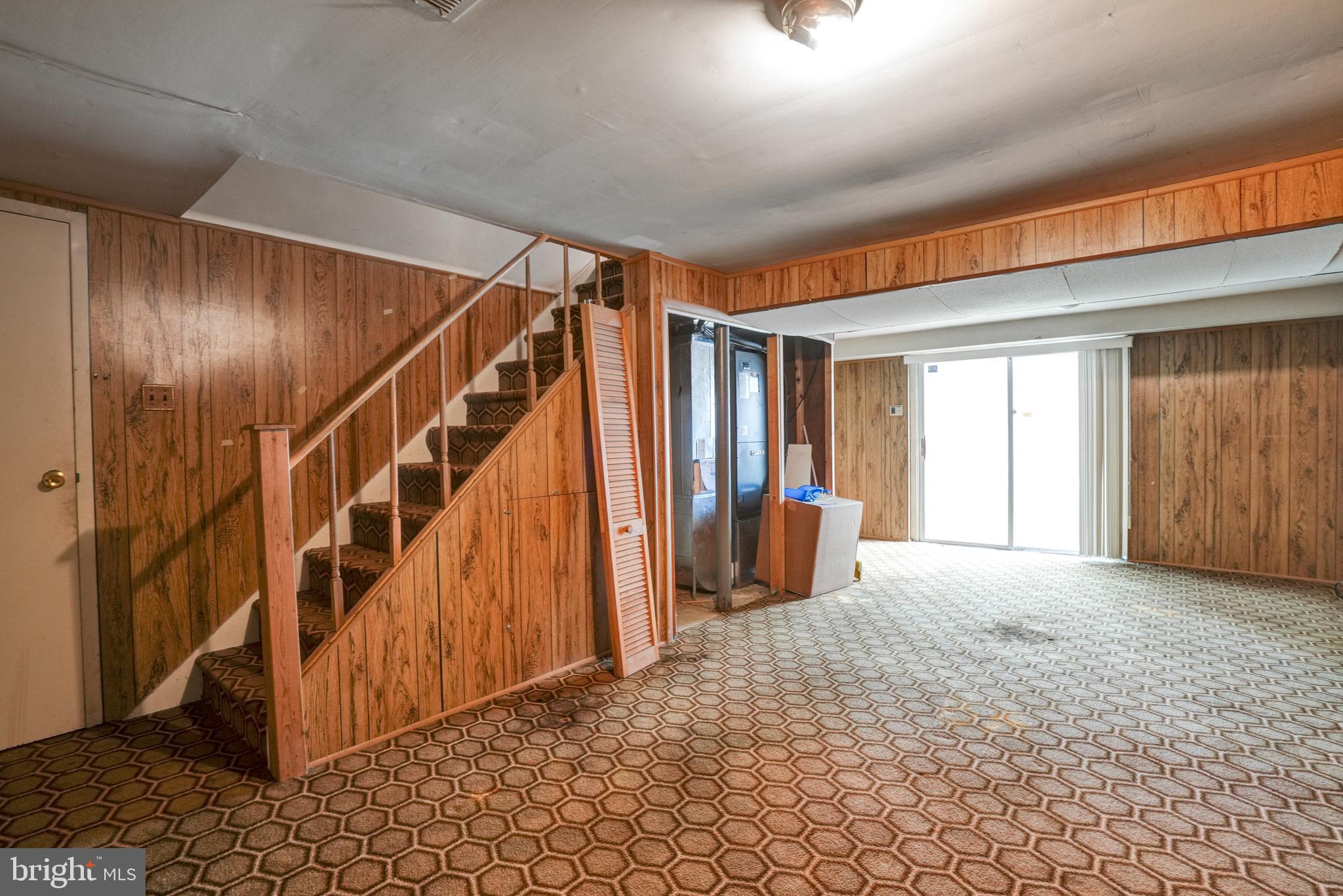 70 St Davids Road Springfield, PA 19064 - Photo 26 of 39 a view of an empty room with wooden floor and stairs