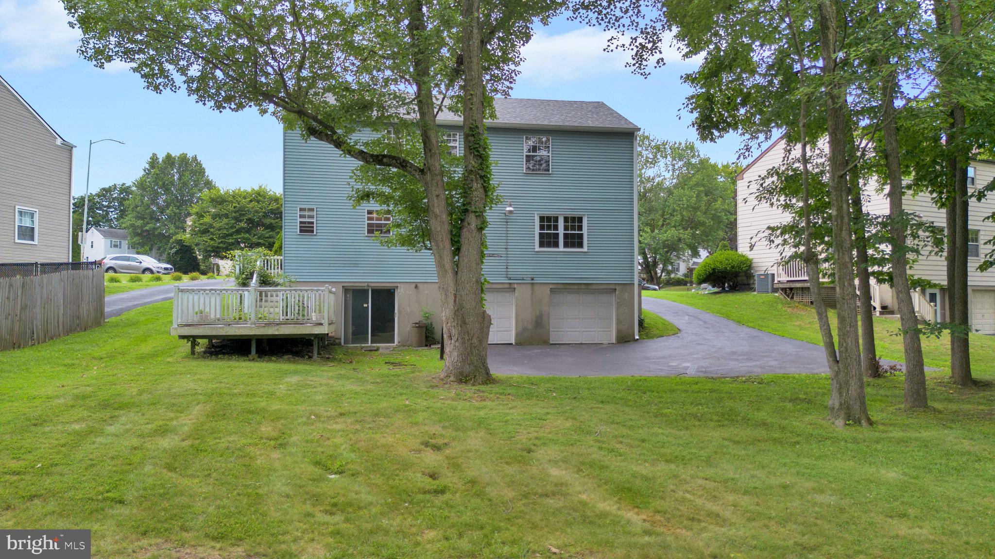 70 St Davids Road Springfield, PA 19064 - Photo 35 of 39 a front view of a house with a yard and garage