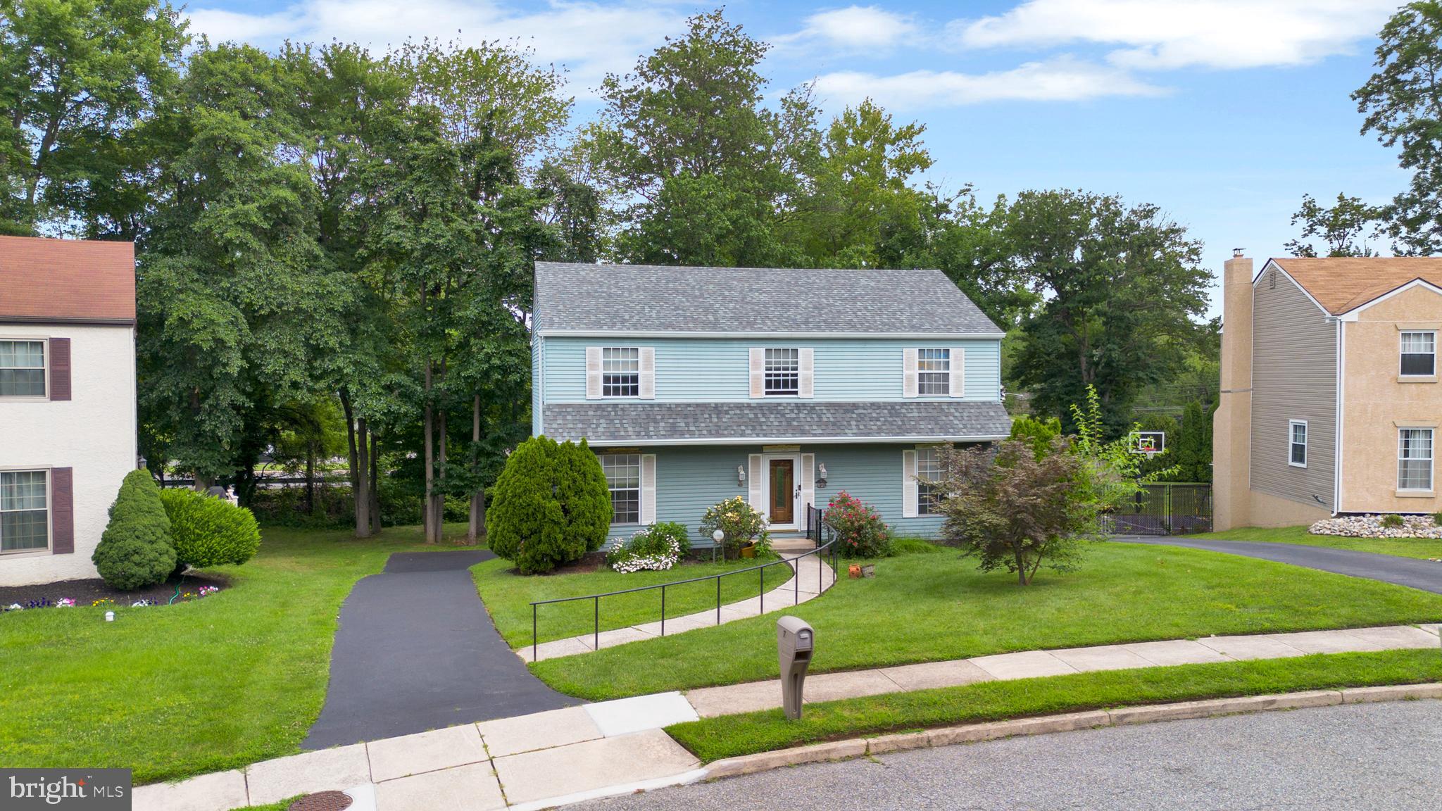 70 St Davids Road Springfield, PA 19064 - Photo 39 of 39 a front view of a house with a garden and trees