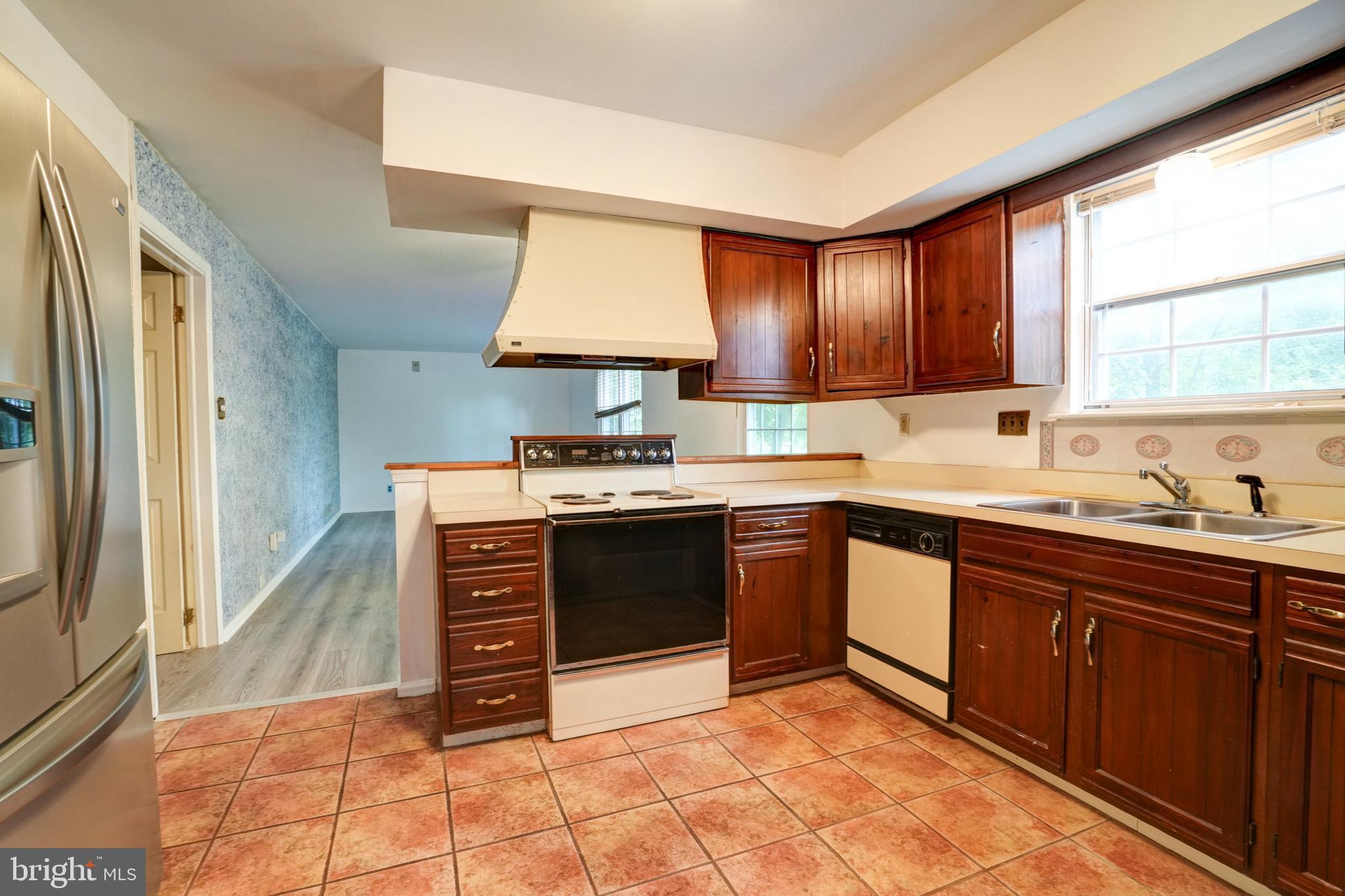 70 St Davids Road Springfield, PA 19064 - Photo 8 of 39 a kitchen with stainless steel appliances granite countertop a stove sink and cabinets
