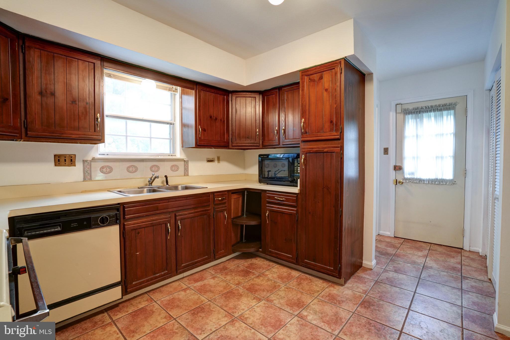 70 St Davids Road Springfield, PA 19064 - Photo 9 of 39 a kitchen with stainless steel appliances granite countertop a refrigerator and sink