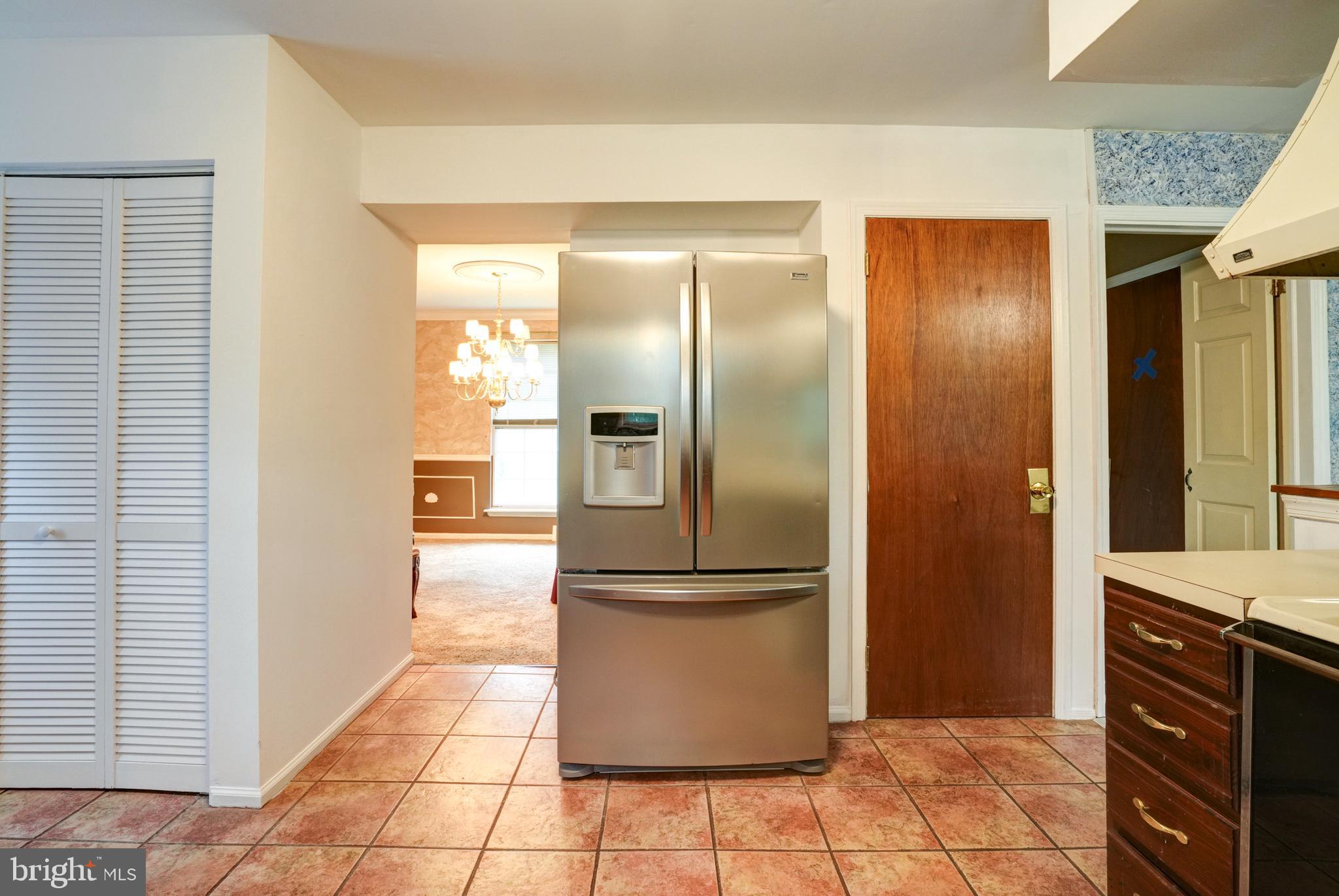 70 St Davids Road Springfield, PA 19064 - Photo 10 of 39 a kitchen with stainless steel appliances granite countertop a refrigerator and a stove