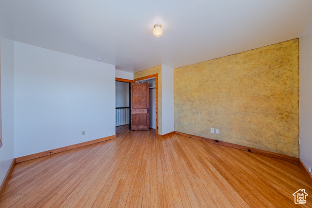 6178 East Zion Road Kanab, UT 84741 - Photo 35 of 48 Unfurnished room with baseboards and wood finished floors