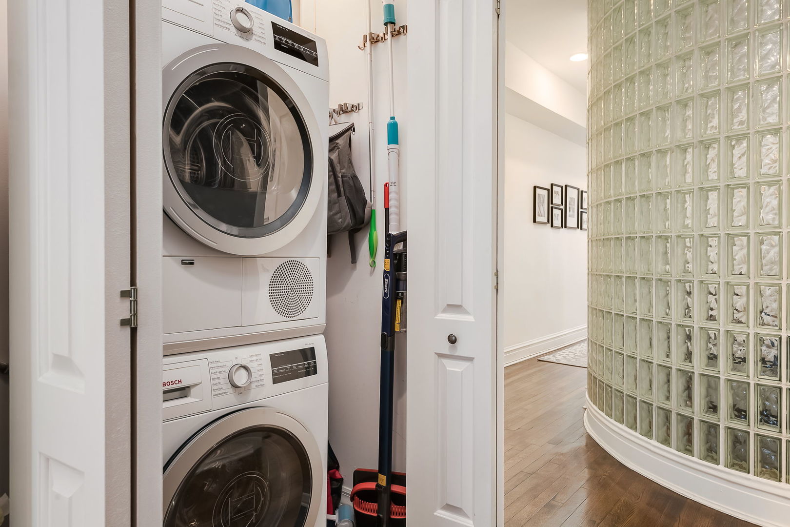 Undisclosed Address Chicago, IL 60657 - Photo 21 of 24 a view of a hallway with washer and dryer