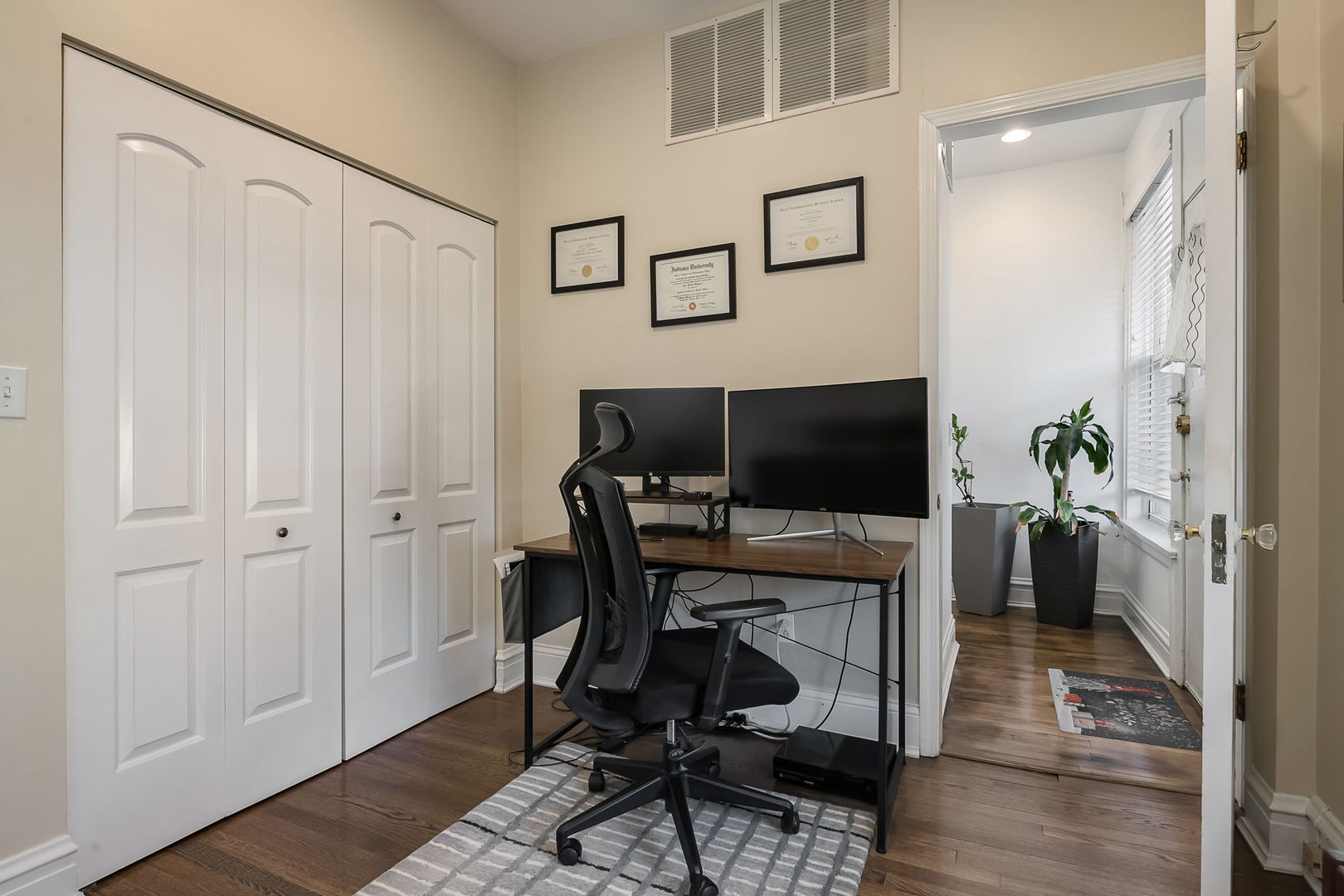 Undisclosed Address Chicago, IL 60657 - Photo 24 of 24 a view of a workspace with furniture and wooden floor