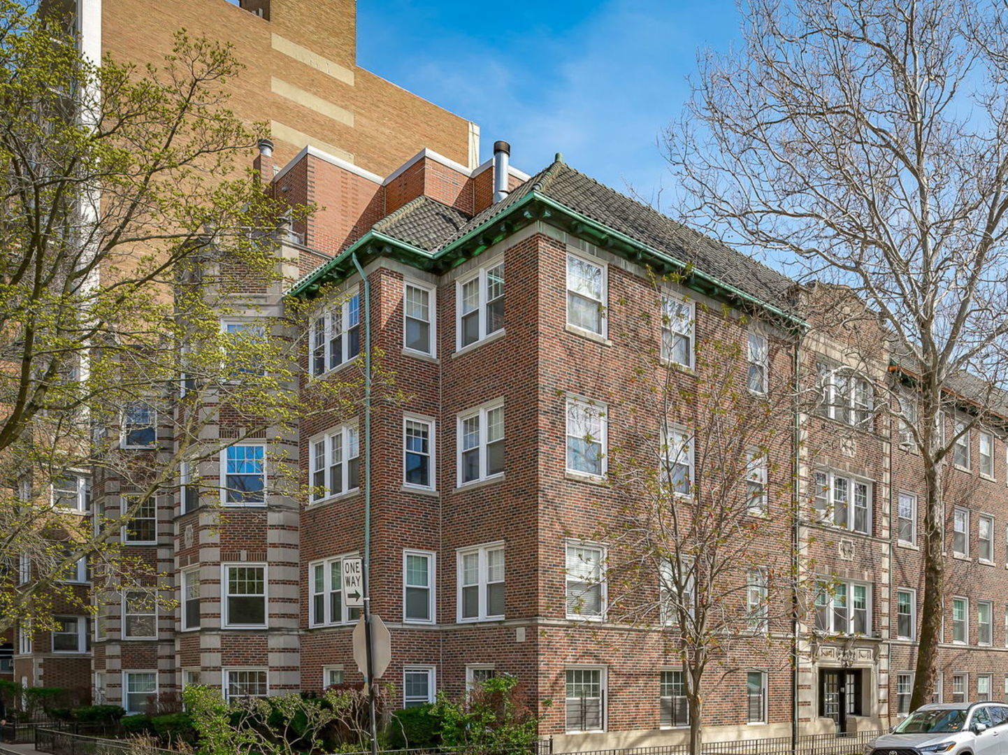 Undisclosed Address Chicago, IL 60657 - Photo 3 of 24 a view of a building with a yard