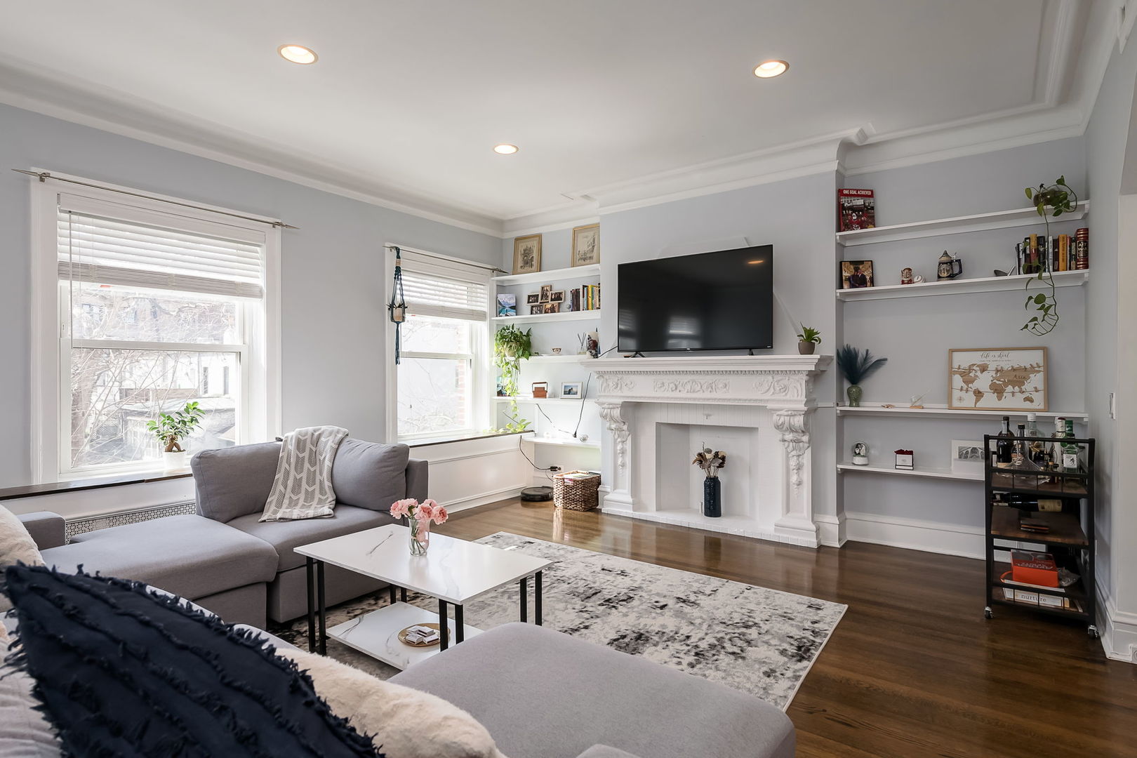 Undisclosed Address Chicago, IL 60657 - Photo 7 of 24 a living room with furniture a flat screen tv and a fireplace