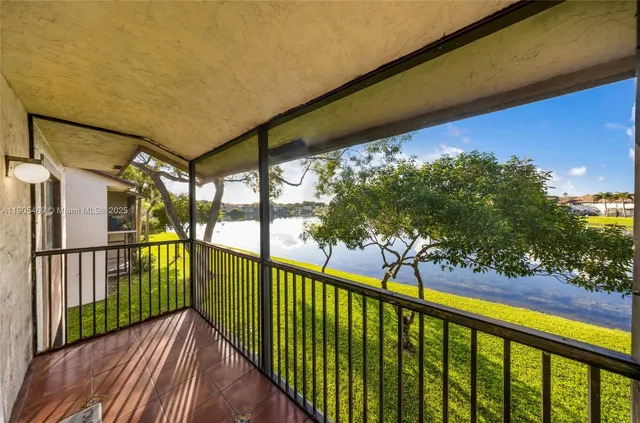 a view of a balcony with wooden floor